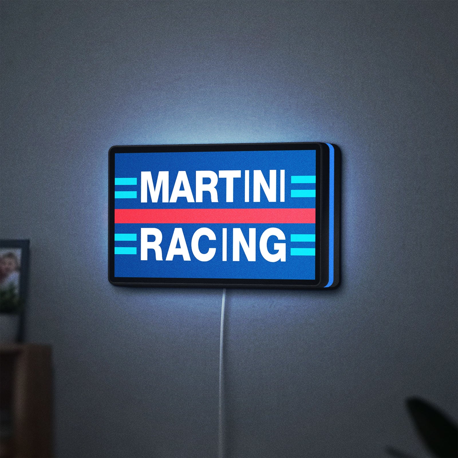 Martini Racing LED lightbox hanging on a wall with blue glow