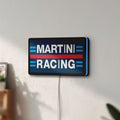 Unlit Martini Racing LED lightbox mounted on a wall in daylight
