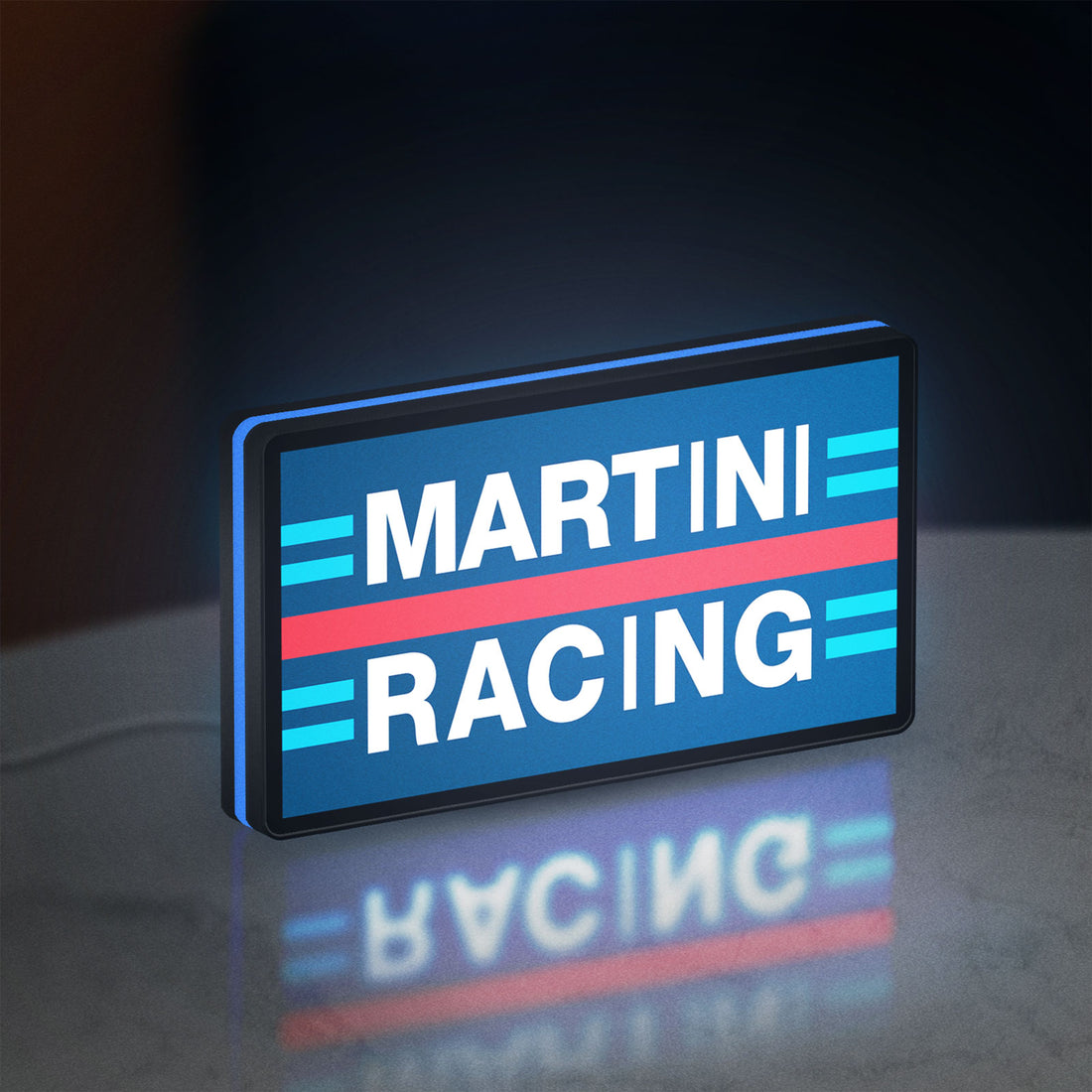 Martini Racing LED lightbox hanging on a wall with blue glow