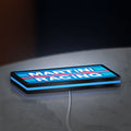 Martini Racing LED lightbox lying flat on a desk with blue glow