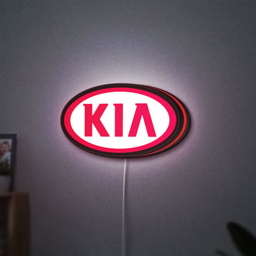 KIA LED lightbox hanging on a wall with red glow