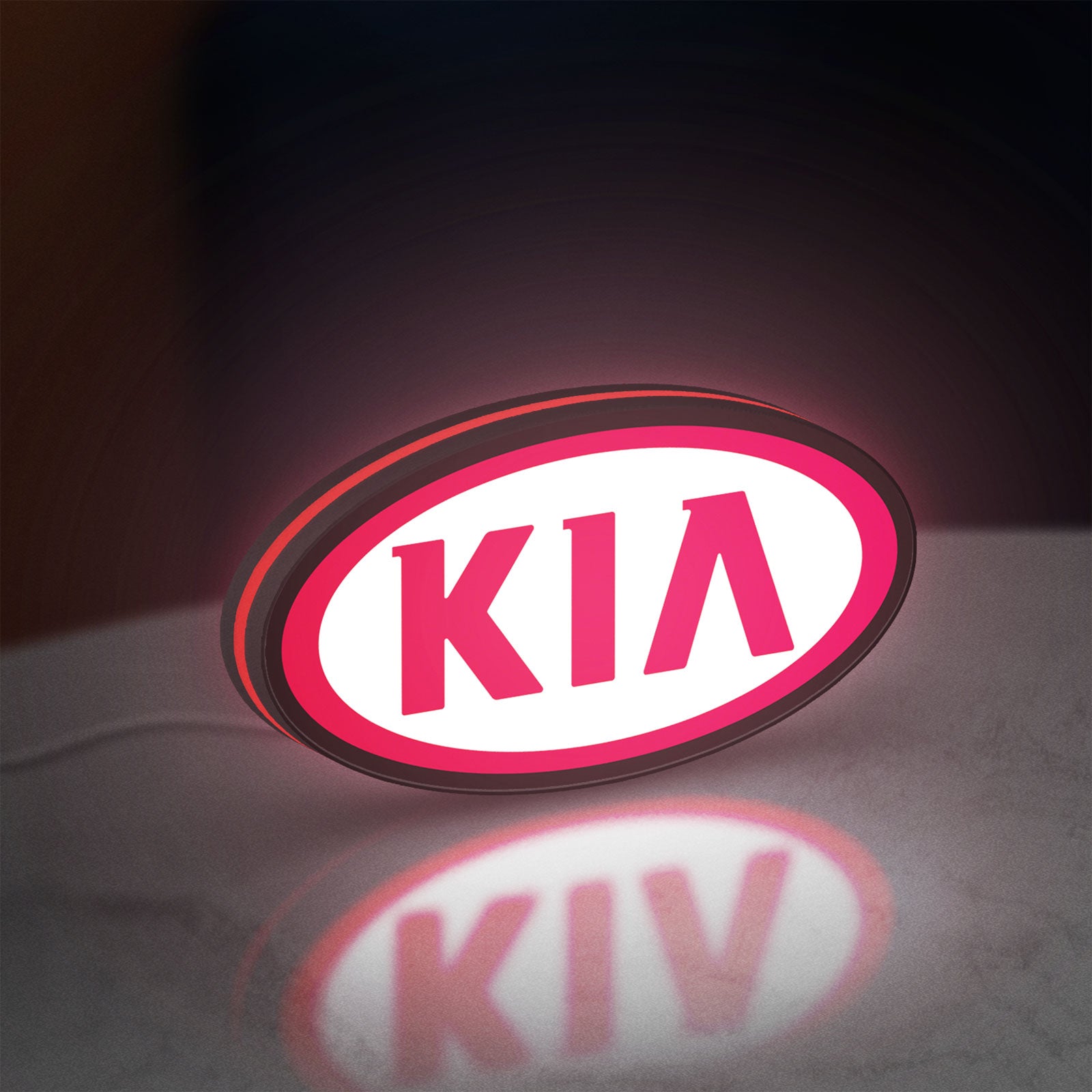 KIA LED lightbox standing on a desk from an angled side view with red glow
