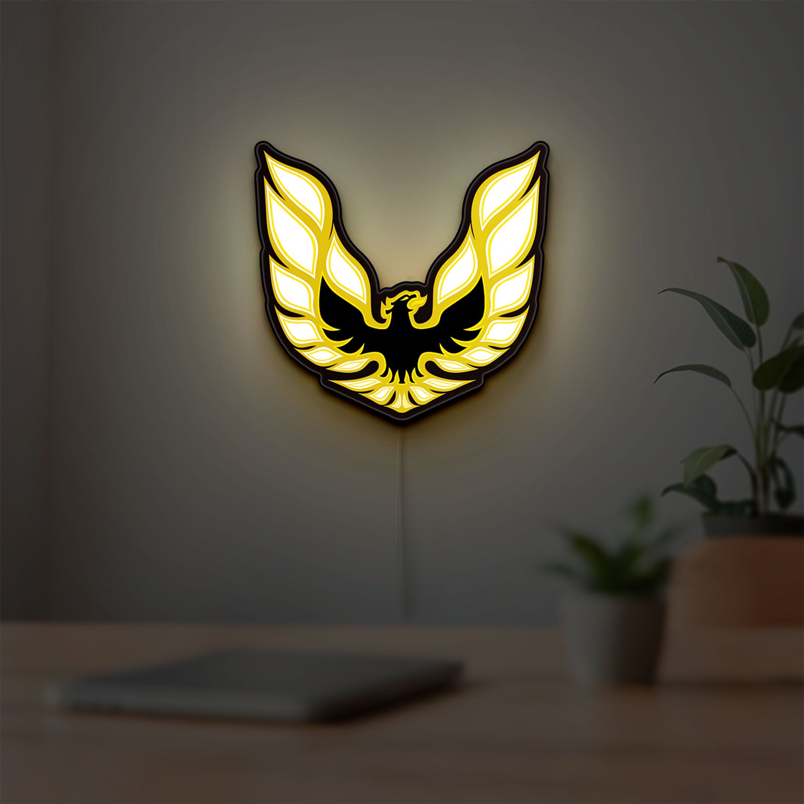 Pontiac Firebird 1977 LED lightbox hanging on a room wall with soft yellow light