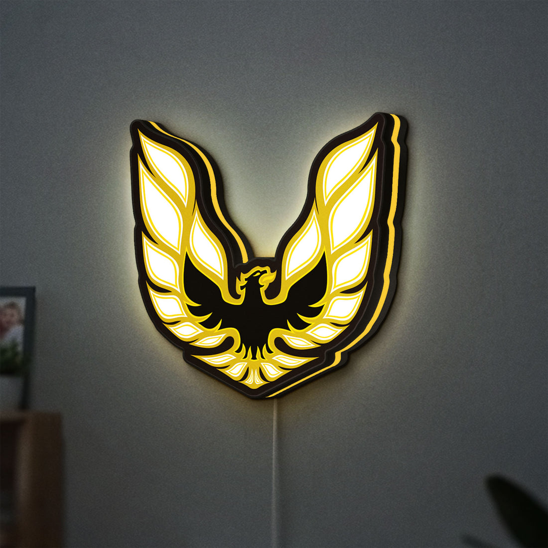 Pontiac Firebird 1977 LED lightbox hanging on a wall with yellow glow