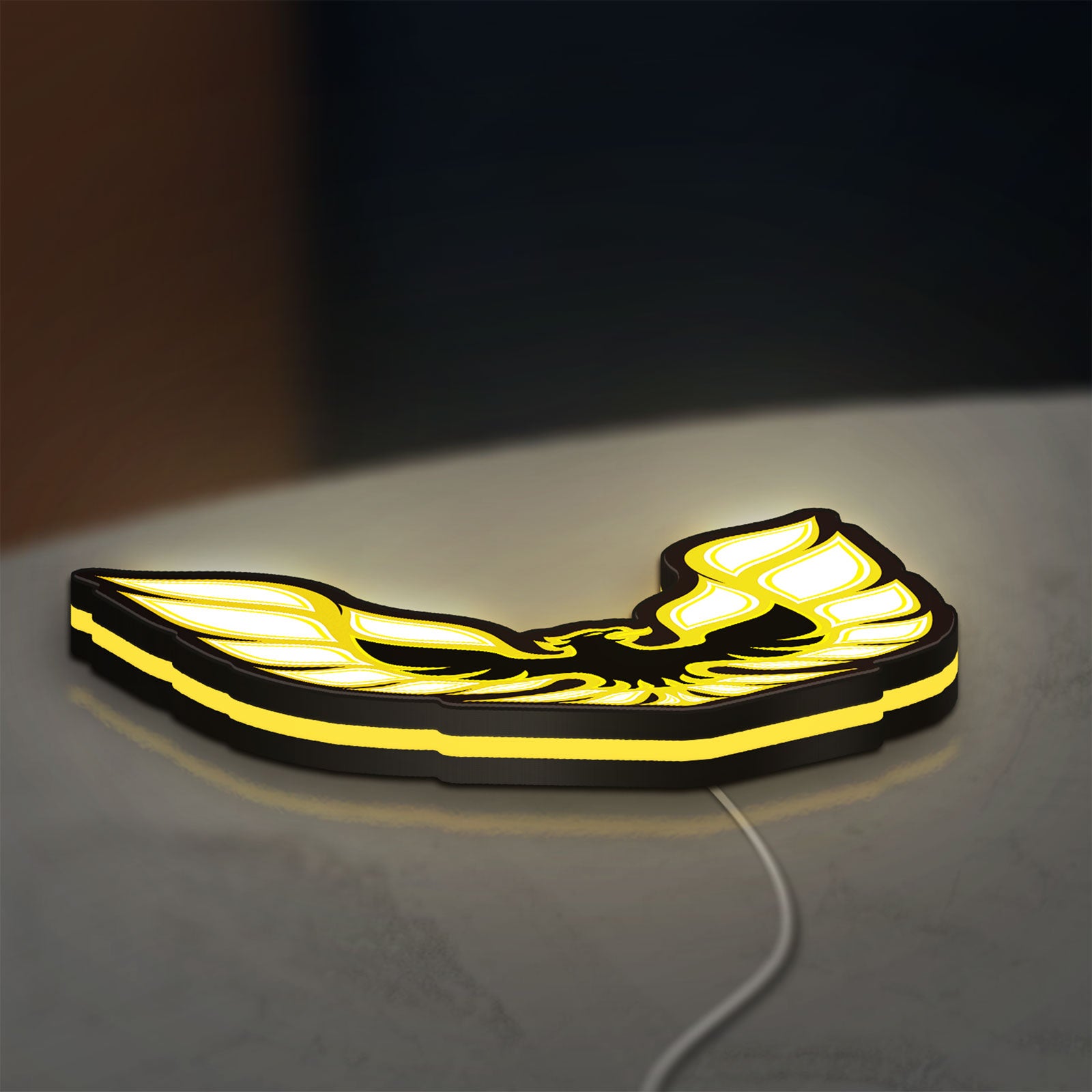 Pontiac Firebird 1977 LED lightbox lying flat on a desk with yellow glow