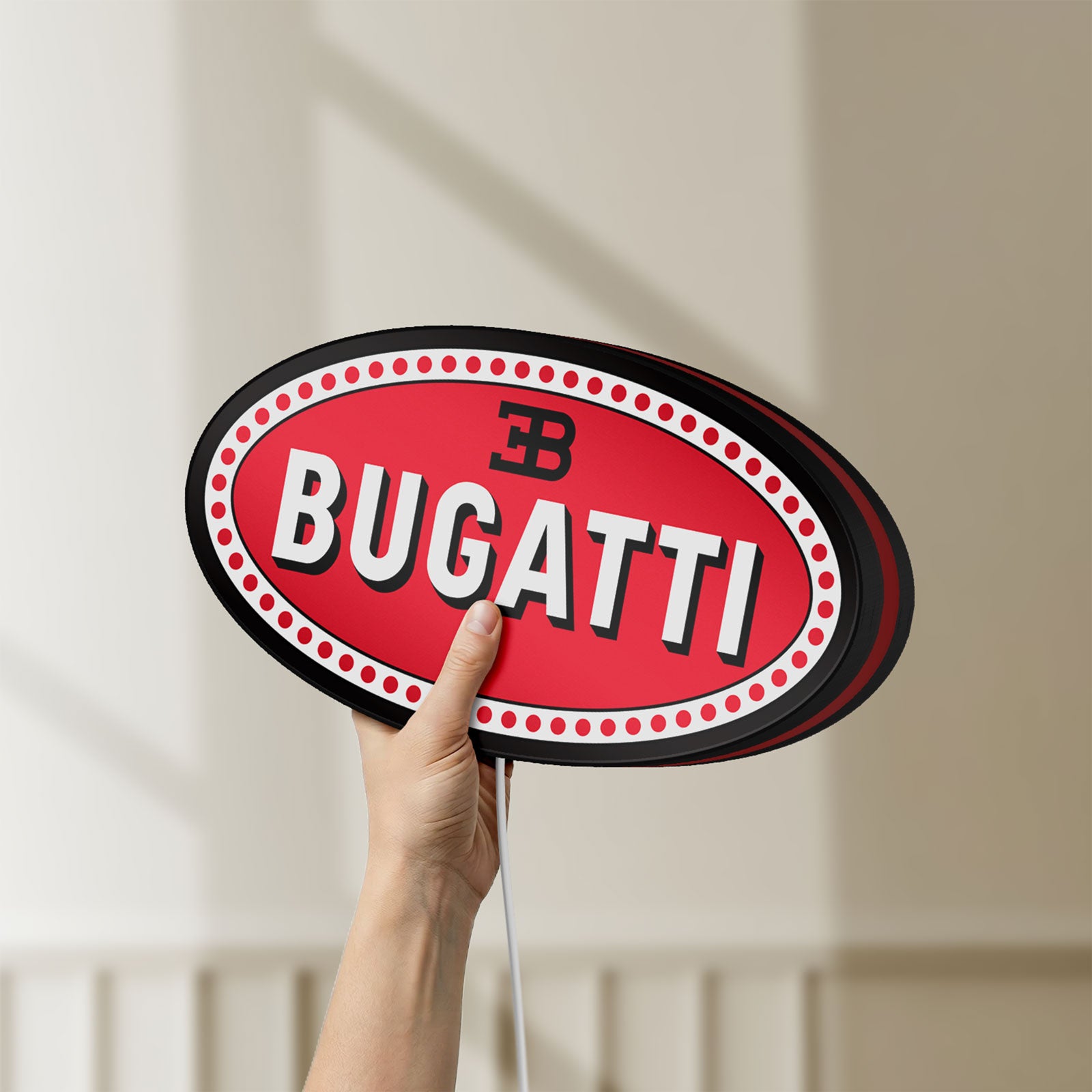 Unlit Bugatti LED lightbox held by hand to show size and details