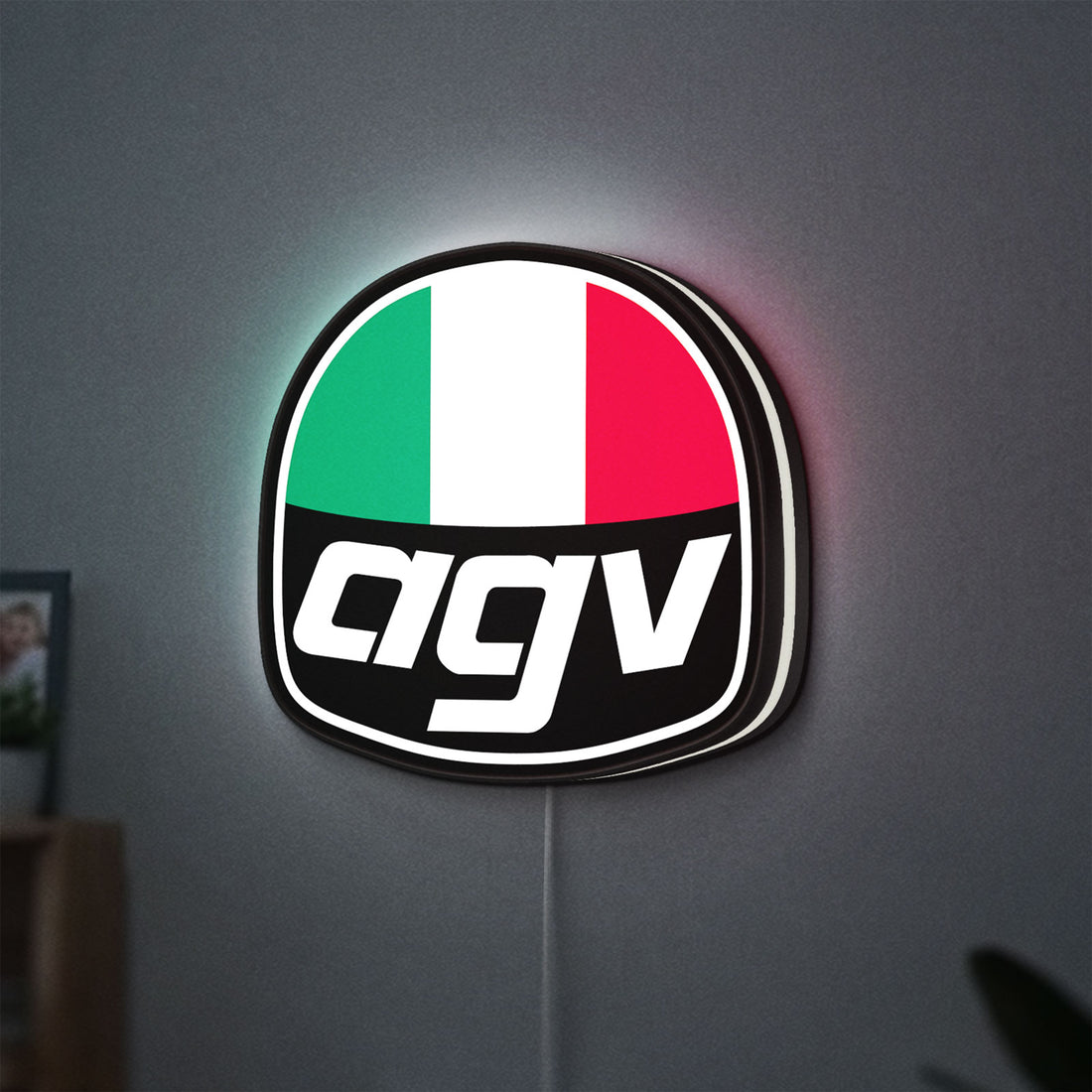 AGV Racing LED lightbox hanging on a wall with white glow