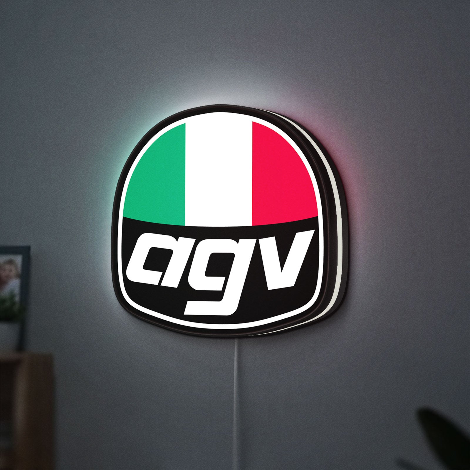 AGV Racing LED lightbox hanging on a wall with white glow