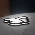 No Good Racing LED lightbox lying flat on a desk with white glow