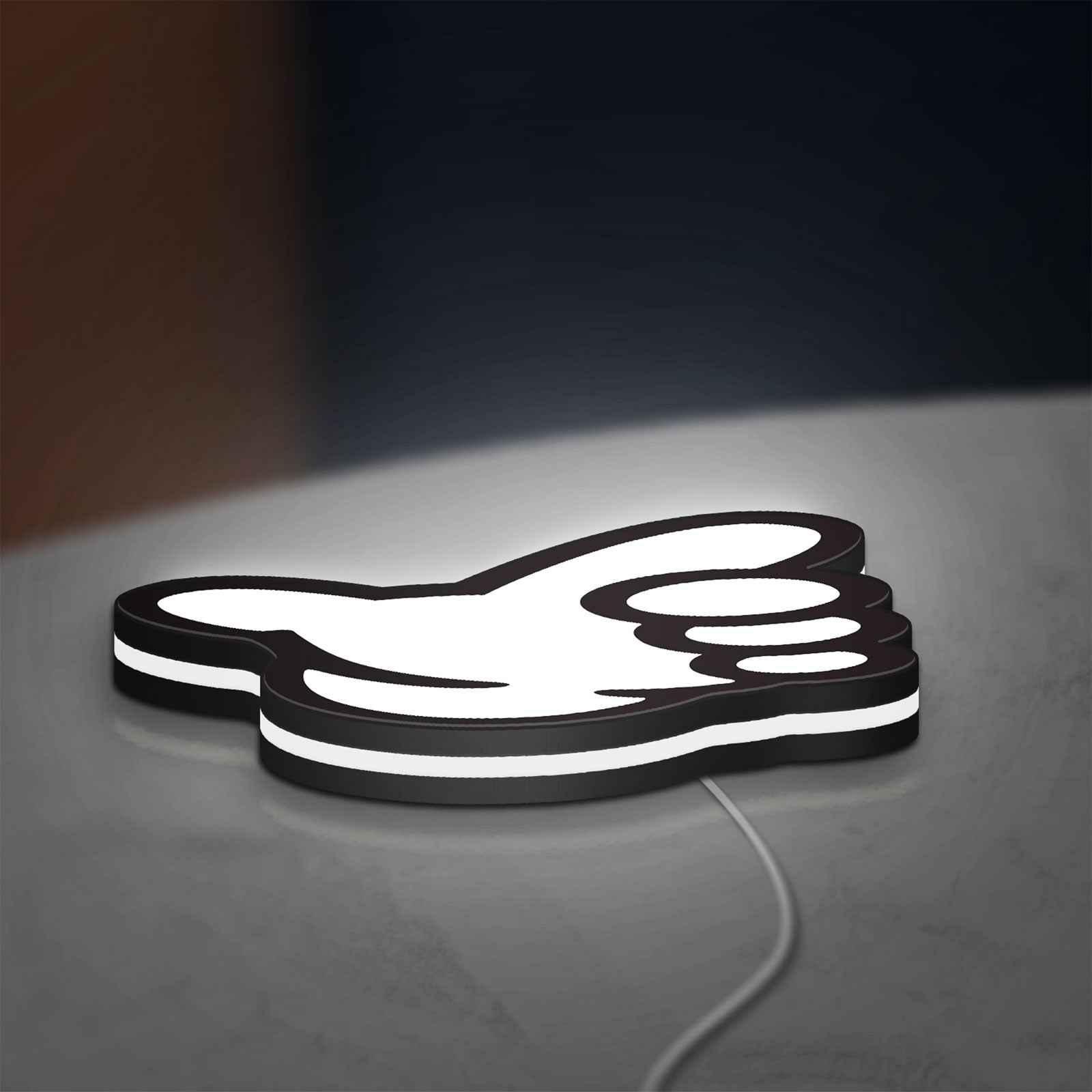 No Good Racing LED lightbox lying flat on a desk with white glow