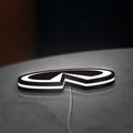 Infiniti LED lightbox lying flat on a desk with white glow