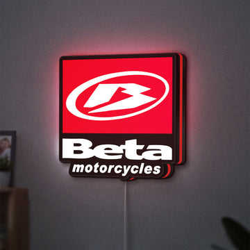 Beta Italian Motorcycles LED lightbox hanging on a wall with red glow