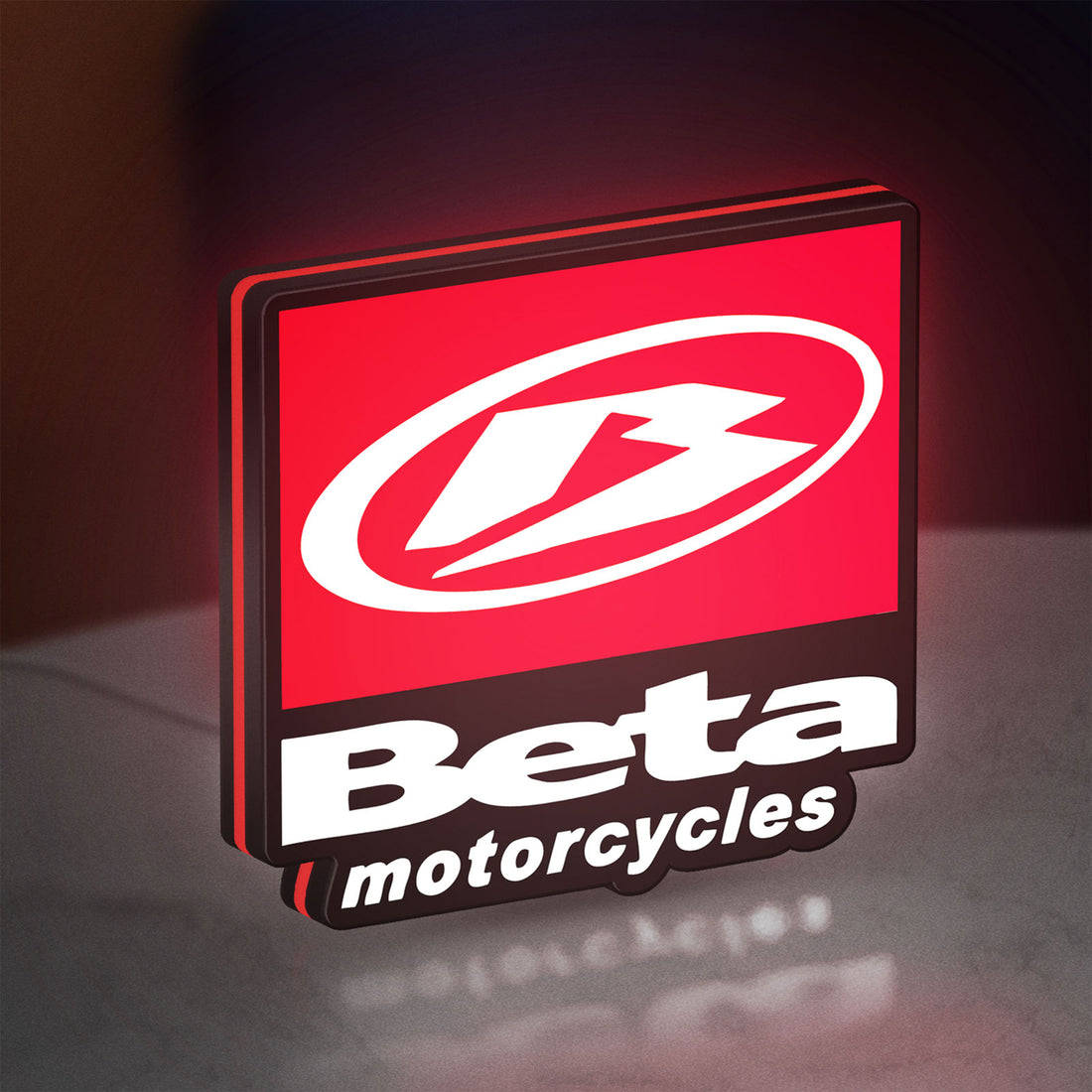 Beta Italian Motorcycles LED lightbox hanging on a wall with red glow
