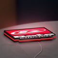 Beta Italian Motorcycles LED lightbox lying flat on a desk with red glow