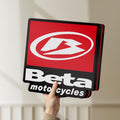 Unlit Beta Italian Motorcycles LED lightbox held by hand to show size and details