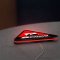 Spoon Sports LED lightbox lying flat on a desk with red glow