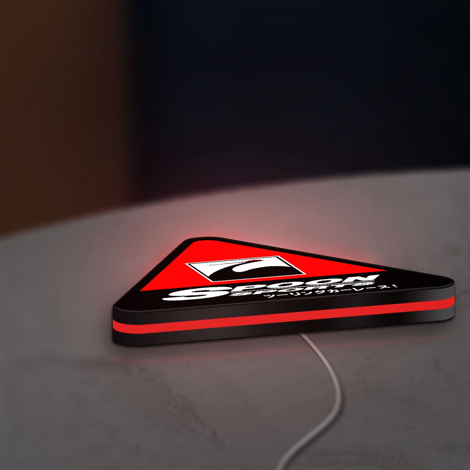Spoon Sports LED lightbox lying flat on a desk with red glow