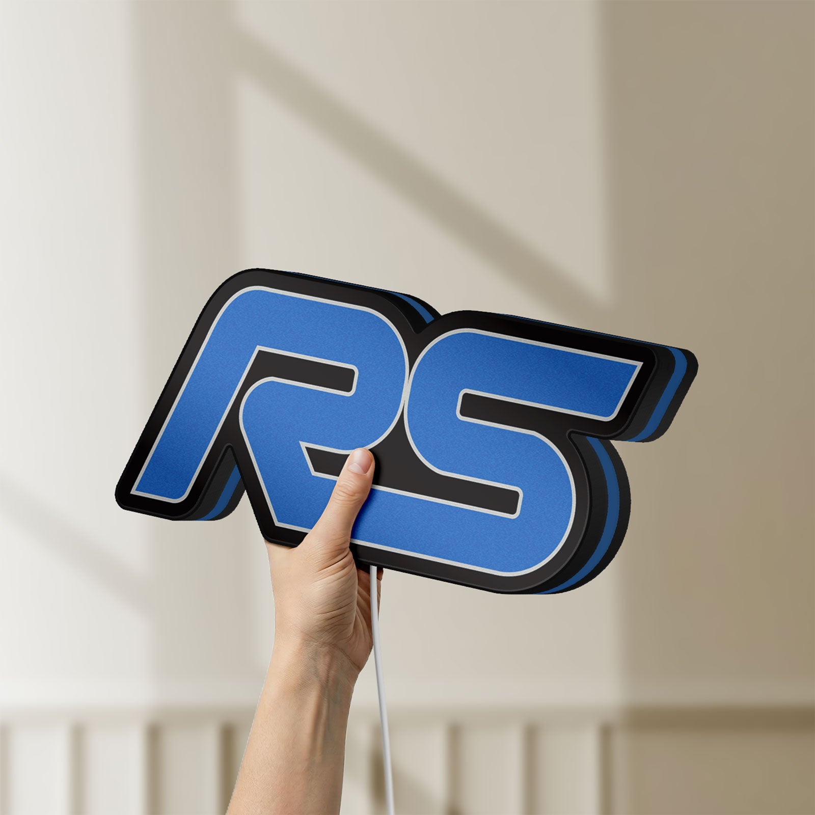 Unlit Ford Focus RS LED lightbox held by hand to show size and details