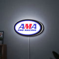 AMA Pro Racing LED lightbox hanging on a wall with white glow