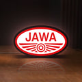 Front view of Jawa Motorcycle LED lightbox sign glowing on a wooden desk