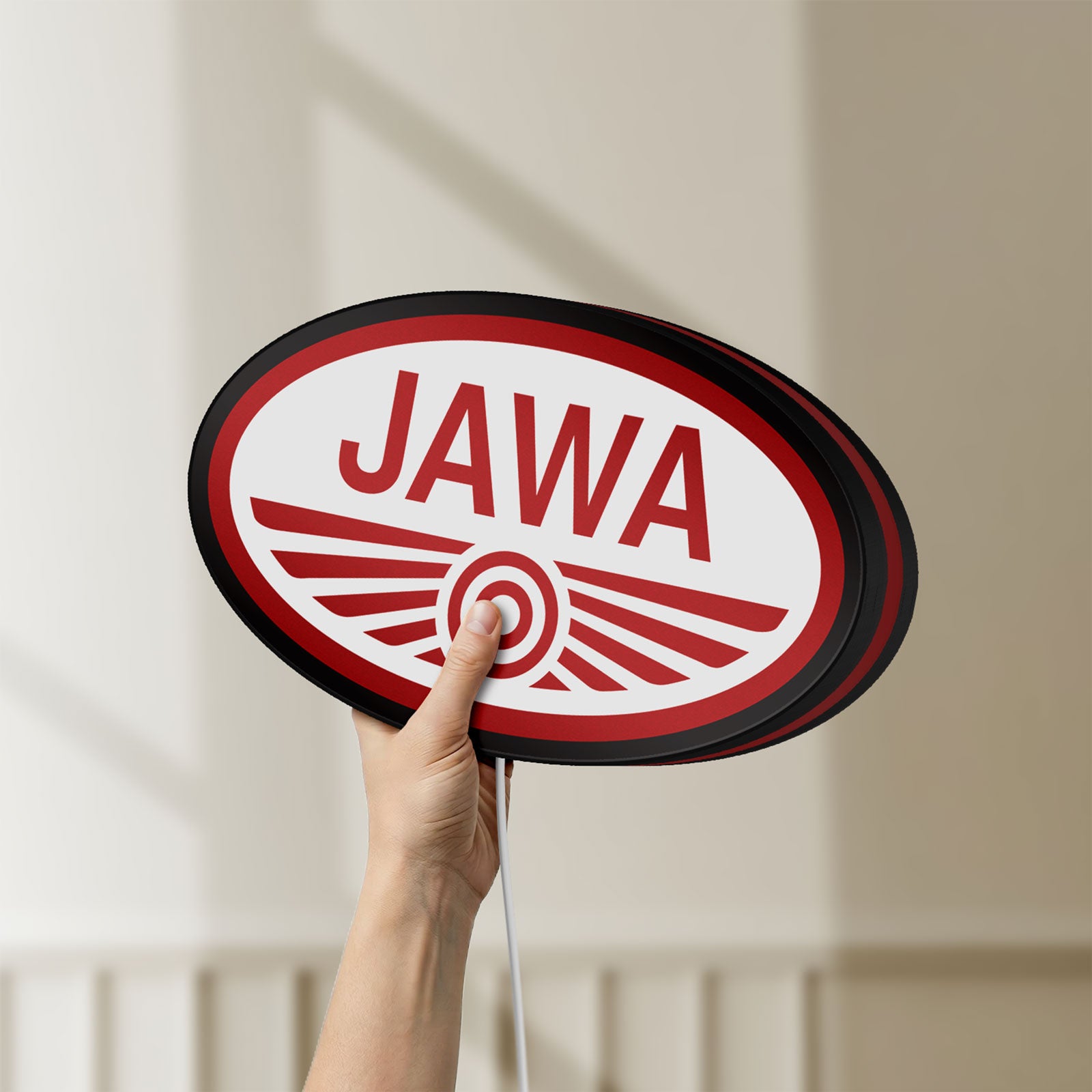 Unlit Jawa Motorcycle LED lightbox held by hand to show size and details