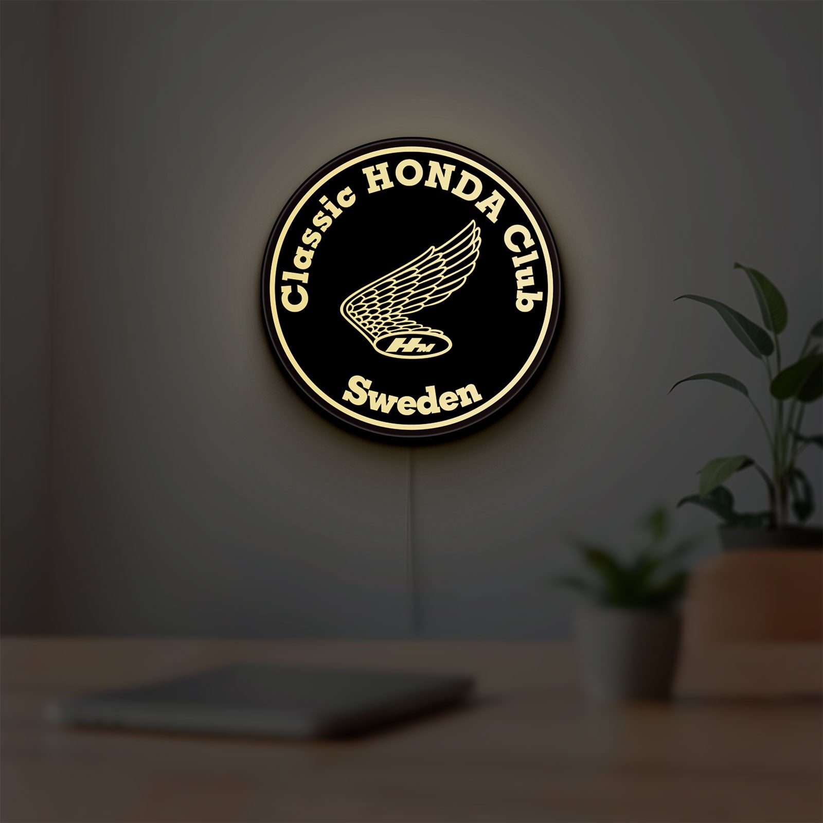 Classic Honda Racing Club LED lightbox hanging on a room wall with soft yellow light