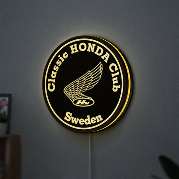 Classic Honda Racing Club LED lightbox hanging on a wall with yellow glow
