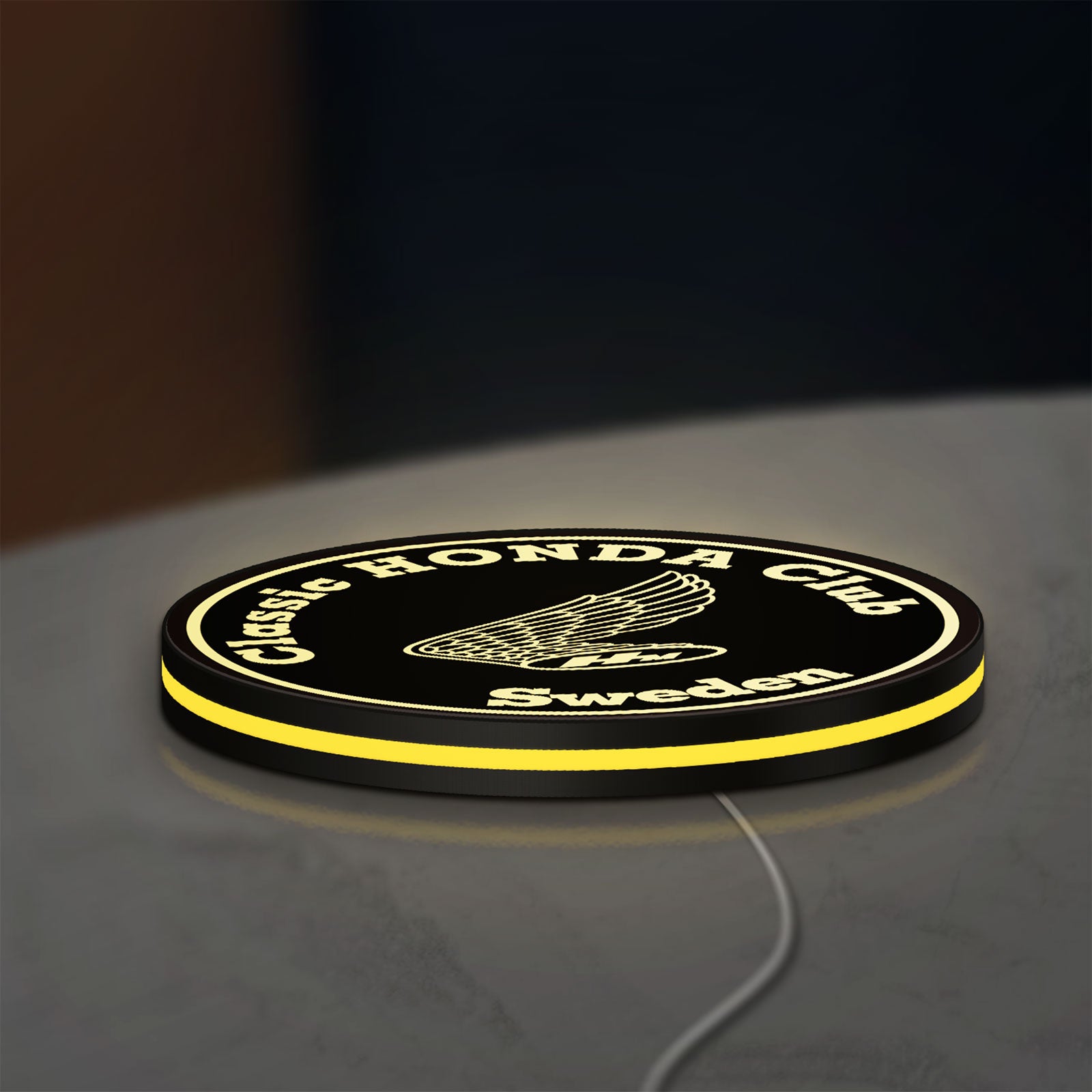 Classic Honda Racing Club LED lightbox lying flat on a desk with yellow glow