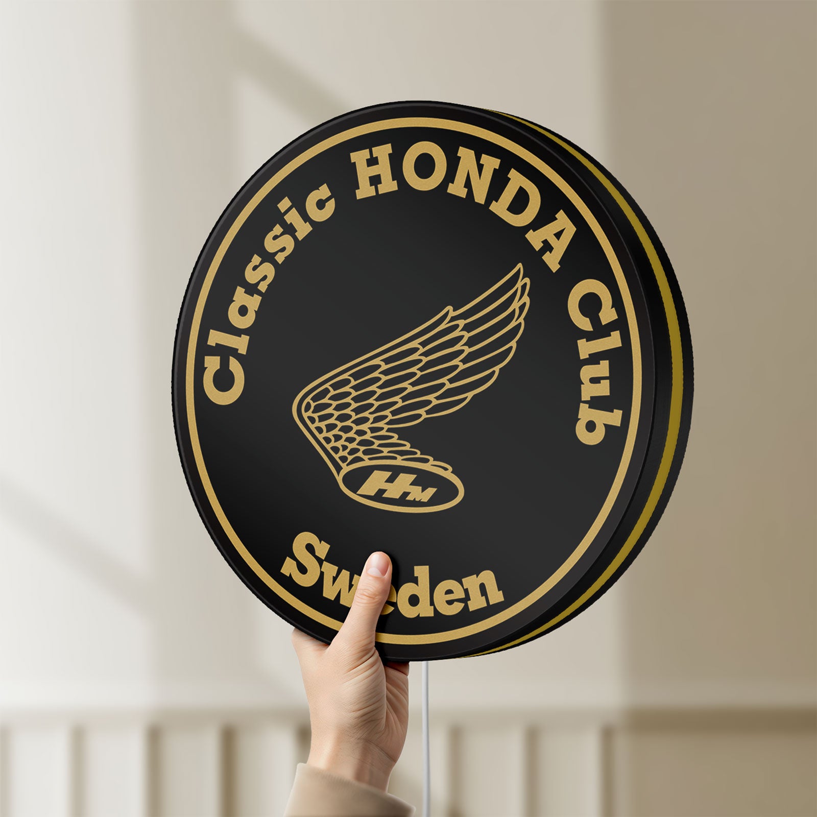 Unlit Classic Honda Racing Club LED lightbox held by hand to show size and details