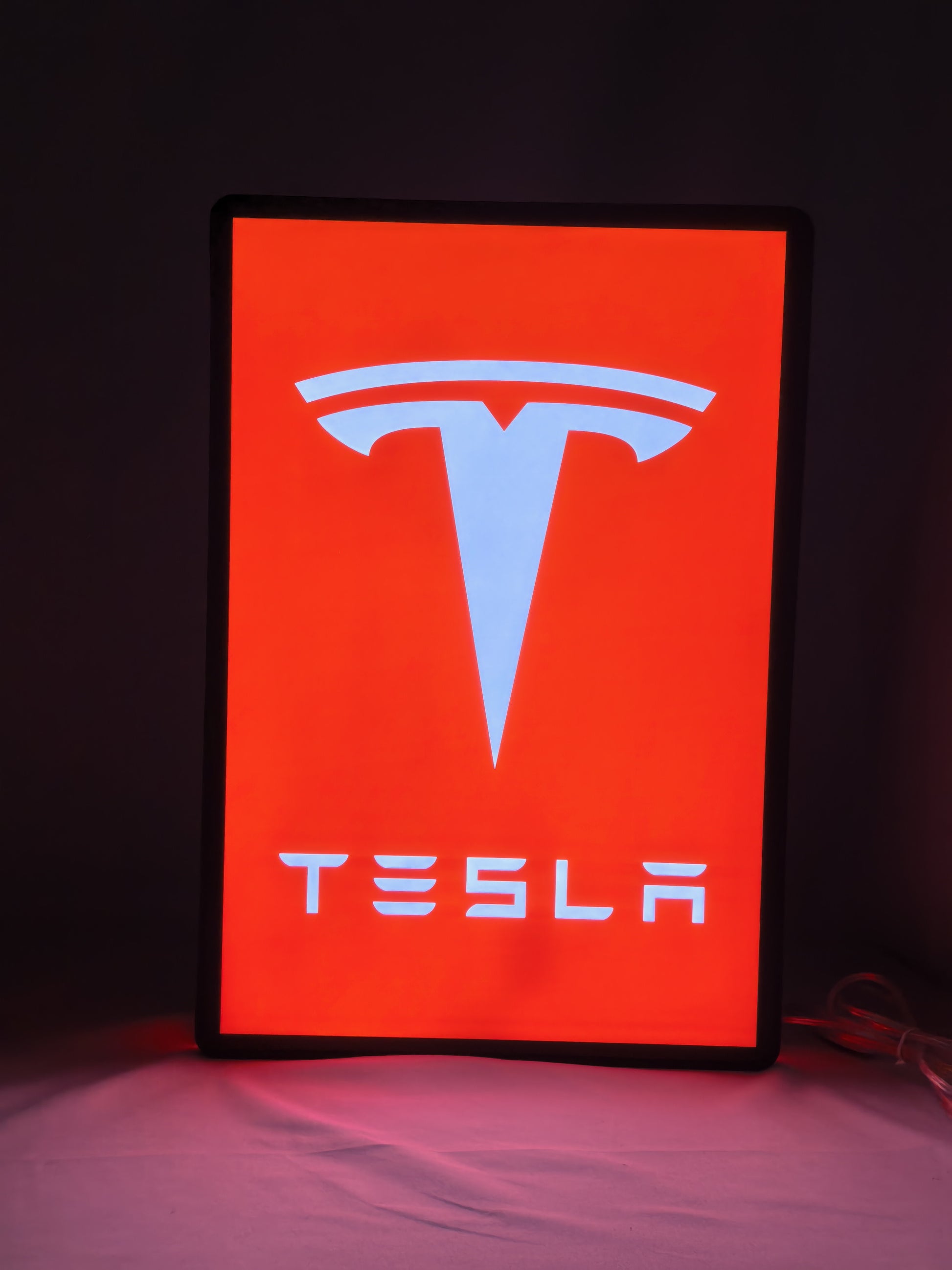 Illuminated front view standing of Tesla Illuminated Sign in 40cm, perfect for garage and man cave decor