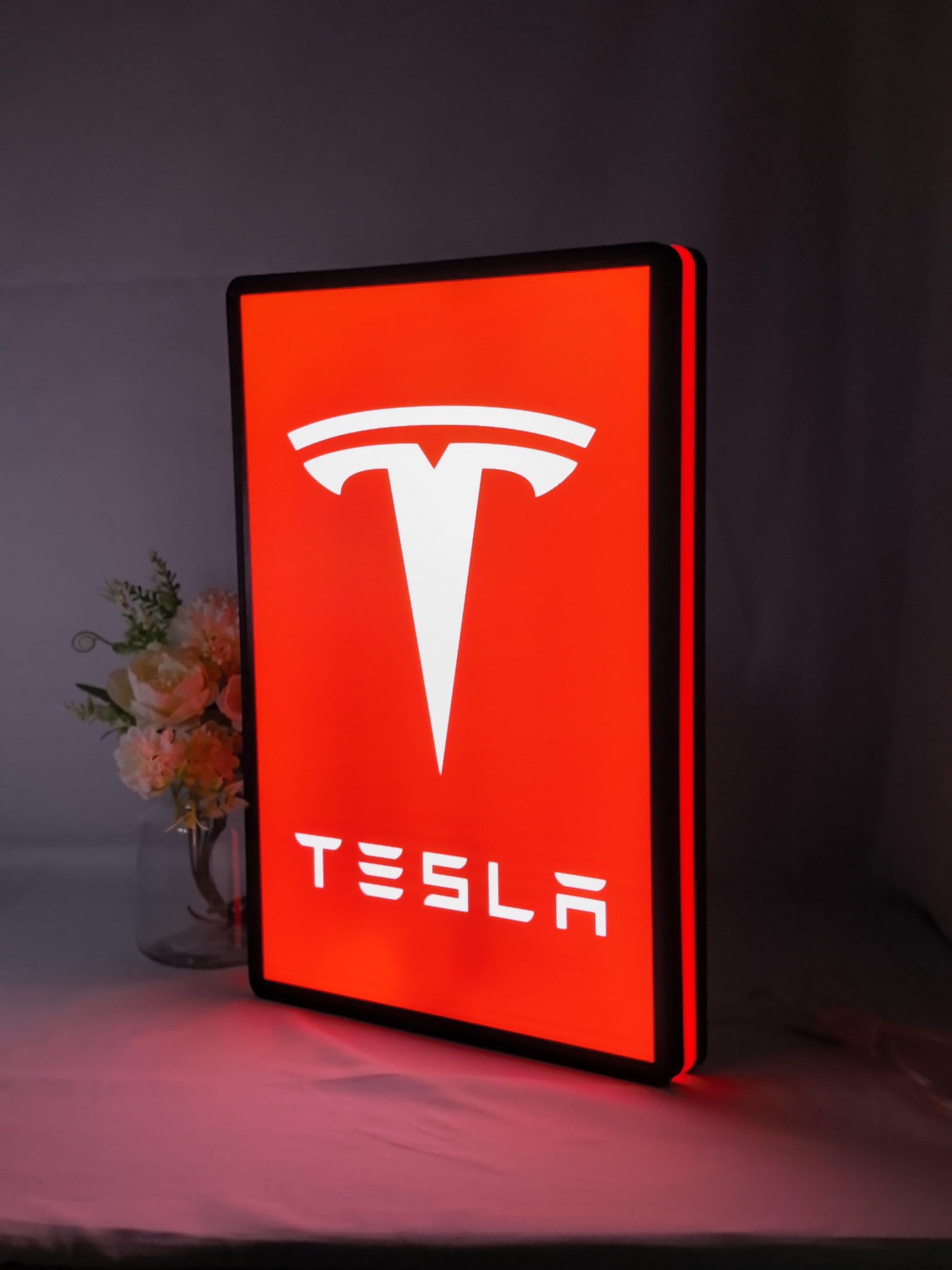 Tesla LED Light Box (40cm) - Illuminated angled view standing, perfect for garage and man cave decor