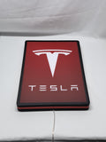 Unlit flat lay angled details of Tesla 3D LED Sign in 40cm, perfect for garage and man cave decor