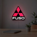 Fuso Truck LED lightbox hanging on a room wall with soft red light
