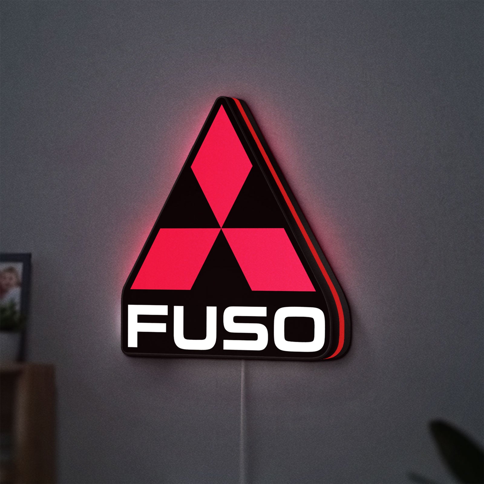 Fuso Truck LED lightbox hanging on a wall with red glow