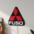 Unlit Fuso Truck LED lightbox mounted on a wall in daylight