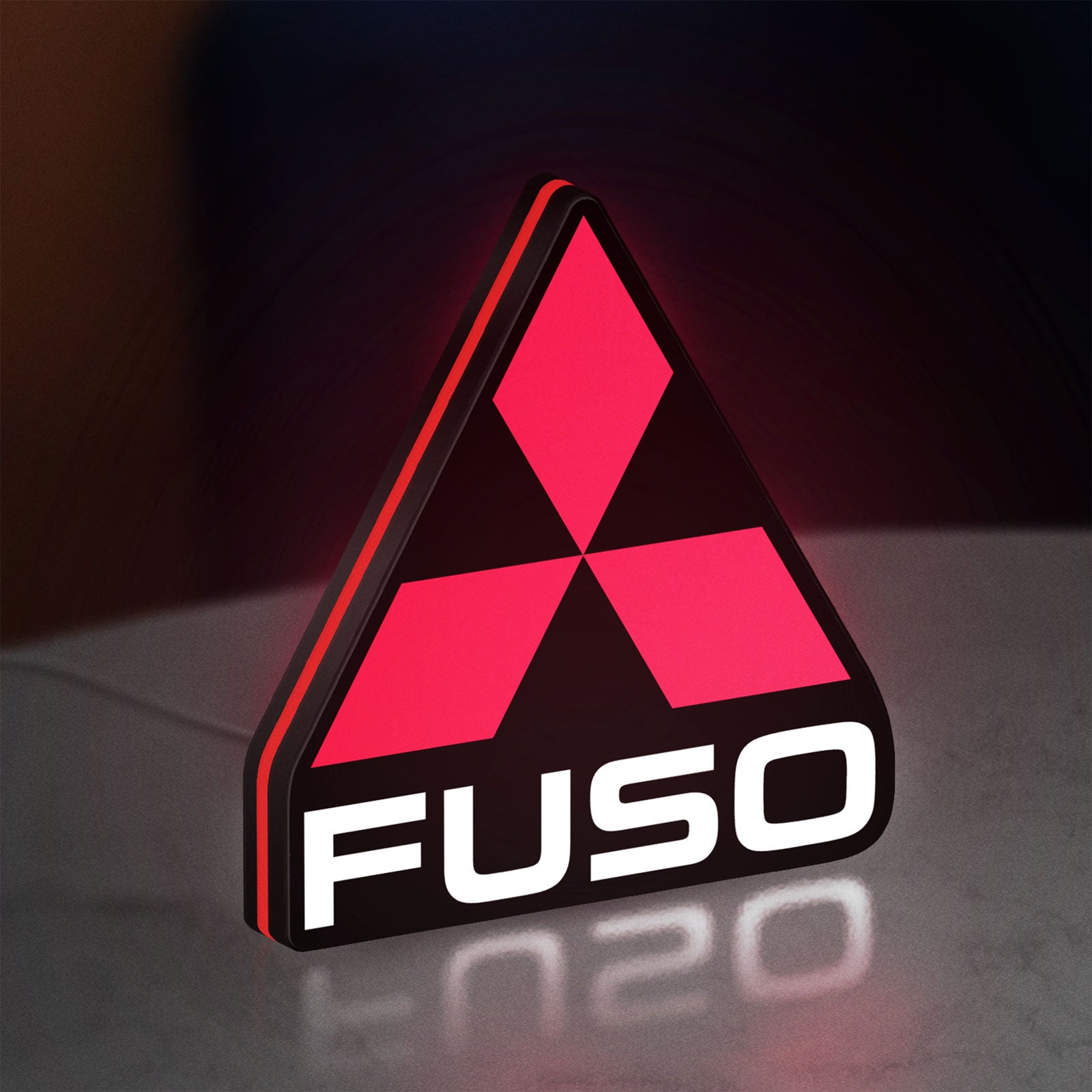 Fuso Truck LED lightbox standing on a desk from an angled side view with red glow