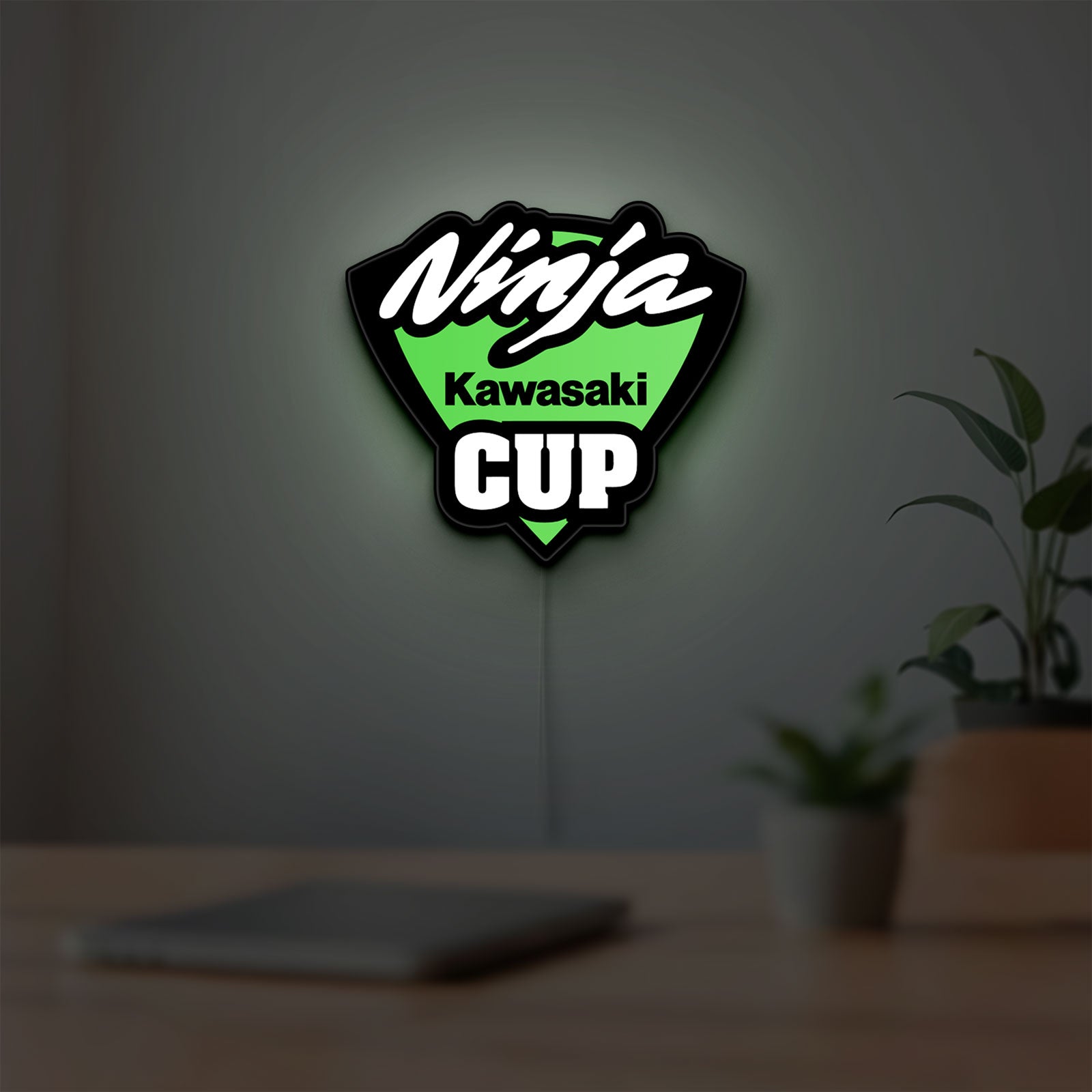 Kawasaki Ninja Cup LED lightbox hanging on a room wall with soft green light