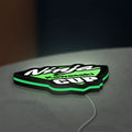 Kawasaki Ninja Cup LED lightbox lying flat on a desk with green glow