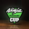 Front view of Kawasaki Ninja Cup LED lightbox sign glowing on a wooden desk