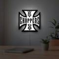 West Coast Choppers LED lightbox hanging on a room wall with soft white light
