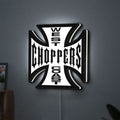 West Coast Choppers LED lightbox hanging on a wall with white glow
