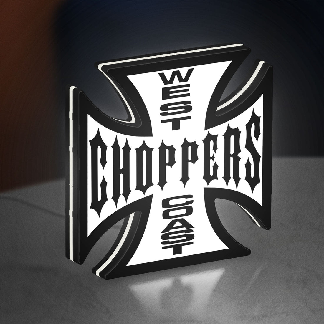 West Coast Choppers LED lightbox hanging on a wall with white glow