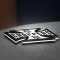 West Coast Choppers LED lightbox lying flat on a desk with white glow