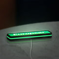 Europcar Sign LED lightbox lying flat on a desk with green glow