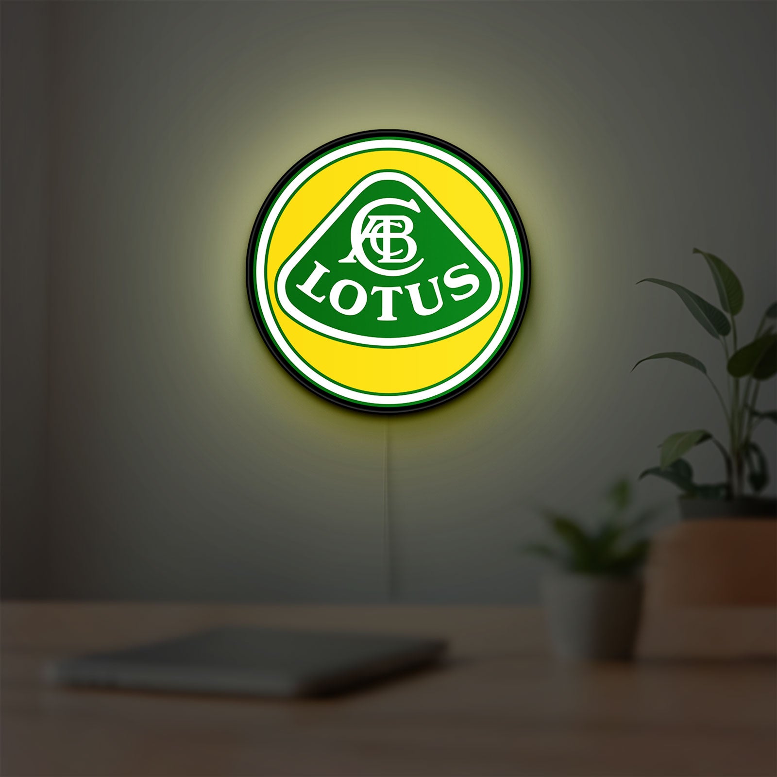 Lotus Cars LED lightbox hanging on a room wall with soft yellow light