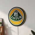 Unlit Lotus Cars LED lightbox mounted on a wall in daylight
