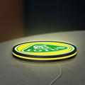 Lotus Cars LED lightbox lying flat on a desk with yellow glow