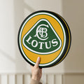 Unlit Lotus Cars LED lightbox held by hand to show size and details