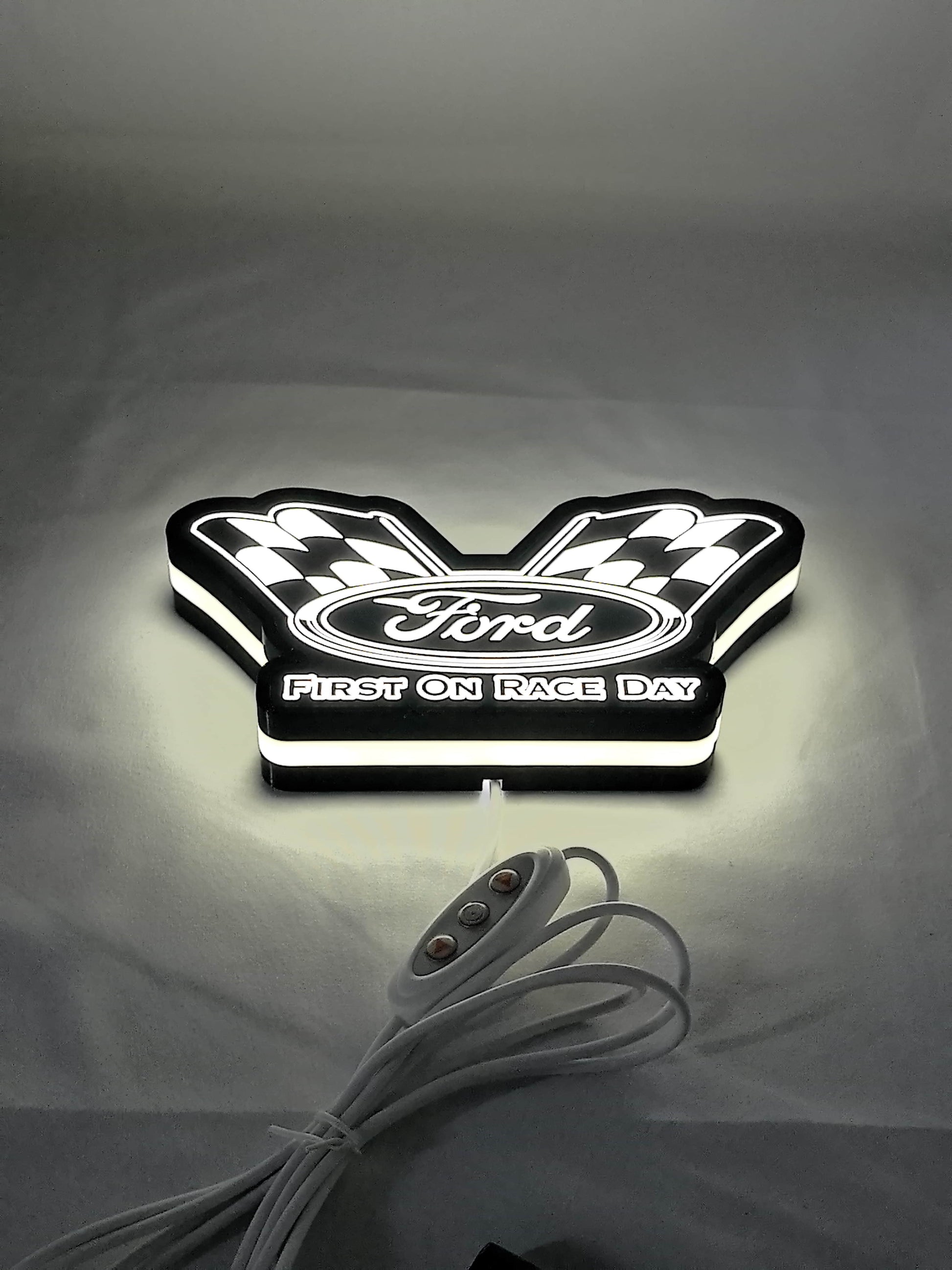 Illuminated flat lay angled view of Ford Racing Illuminated Sign in 20cm, perfect for garage and man cave decor