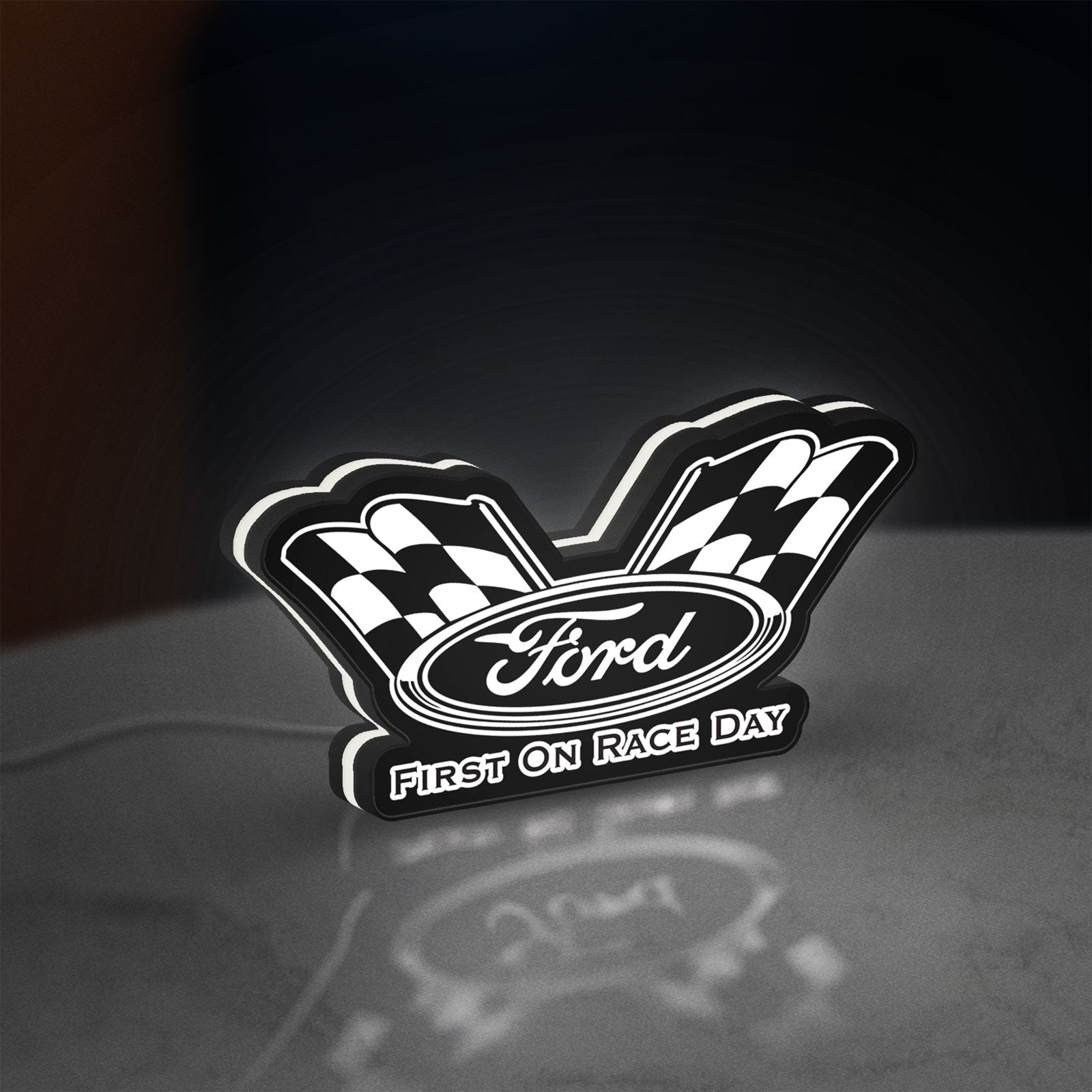 Ford Racing LED lightbox standing on a desk from an angled side view with white glow